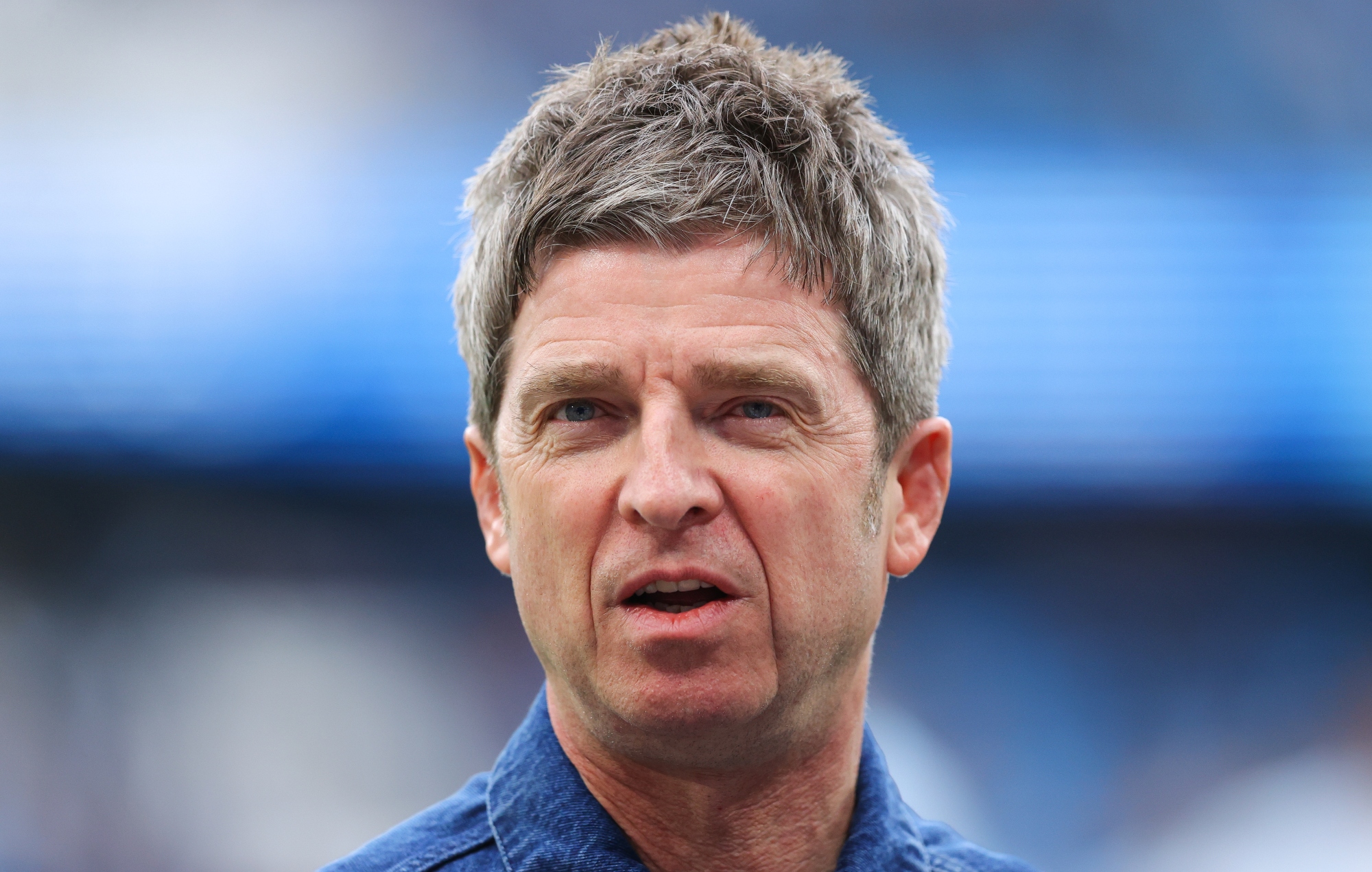 Watch Noel Gallagher refuse to do the Poznan in sea of celebrating Man City fans